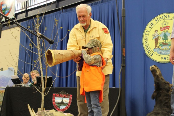 Raquelle Sterris, 5, of Fort Kent demonstrates her moose-calling skills while being coached by her grandfather, John Graves, of Presque Isle during the Maine Professional Guides Association's state championship moose-calling contest in Presque Isle on Saturday. Raquelle Sterris, 5, of Fort Kent demonstrates her moose-calling skills while being coached by her grandfather, John Graves, of Presque Isle during the Maine Professional Guides Association's state championship moose-calling contest in Presque Isle on Saturday.