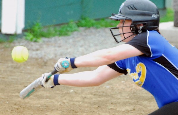 Hermon High School's Kylie Kennedy bunts for a base hit during the second inning of the Eastern Maine Class B semifinal softball game against Old Town on Saturday afternoon at Old Town. Hermon won 6-4. Hermon High School's Kylie Kennedy bunts for a base hit during the second inning of the Eastern Maine Class B semifinal softball game against Old Town on Saturday afternoon at Old Town. Hermon won 6-4.