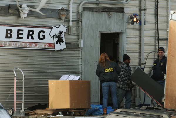 Federal agents watch as filing cabinets are loaded into a moving truck at Berg Sportswear in Corinna in this January 2011 file photo. Federal agents watch as filing cabinets are loaded into a moving truck at Berg Sportswear in Corinna in this January 2011 file photo.