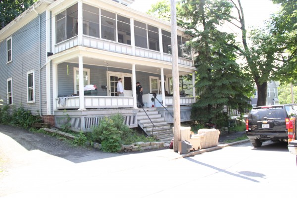 Police and city officials removed about a dozen alleged squatters from a foreclosed building on Garland Street on Wednesday. Police and city officials removed about a dozen alleged squatters from a foreclosed building on Garland Street on Wednesday.