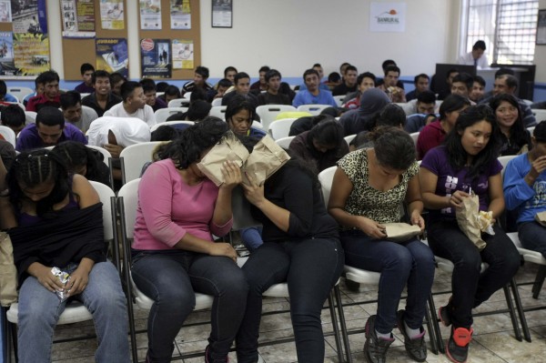 Illegal migrants from Guatemala who have been deported from the U.S. wait to provide their particulars to the immigration authorities after arriving at La Aurora airport in Guatemala City, July 10, 2014. Illegal migrants from Guatemala who have been deported from the U.S. wait to provide their particulars to the immigration authorities after arriving at La Aurora airport in Guatemala City, July 10, 2014.