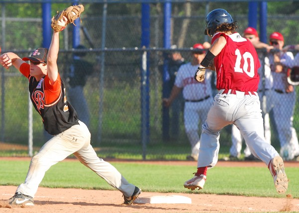 Bangor's Derek Fournier is out at first base on a close play as Brewer first baseman Jack Corey holds onto the throw during a District 3 Senior League tourney game at Mansfield Stadium in Bangor Friday. Bangor won 8-3. Bangor's Derek Fournier is out at first base on a close play as Brewer first baseman Jack Corey holds onto the throw during a District 3 Senior League tourney game at Mansfield Stadium in Bangor Friday. Bangor won 8-3.