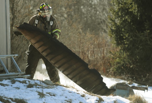 Mike Azevedo removes a charred section of a garage on Horseback Road in Carmel Jan. 25, 2013. The former Carmel fire chief hopes to be given a reason for his dismissal. Mike Azevedo removes a charred section of a garage on Horseback Road in Carmel Jan. 25, 2013. The former Carmel fire chief hopes to be given a reason for his dismissal.