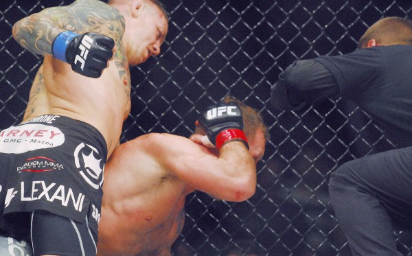 Lightweight fighter Ross Pearson (left) finishes off Gary Maynard during the UFC fights at the Cross Insurance Center in Bangor Saturday night. Lightweight fighter Ross Pearson (left) finishes off Gary Maynard during the UFC fights at the Cross Insurance Center in Bangor Saturday night.