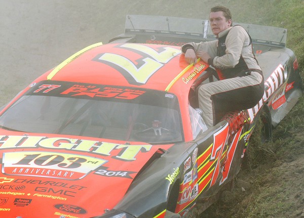 Race winner Cassius Clark climbs out of his car after being bumped off the track after crossing the finish line during the Hight Chevorlet 150 at Speedway 95 in Hermon on Sunday. BDN Photo By Terry Farren Race winner Cassius Clark climbs out of his car after being bumped off the track after crossing the finish line during the Hight Chevorlet 150 at Speedway 95 in Hermon on Sunday. BDN Photo By Terry Farren
