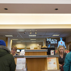 Barbara Donnelly (left) and Felicia Russell serve customers at Maine Savings in Hampden on March 25.