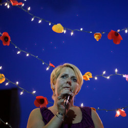 A woman recalls her own struggle with addiction and her recovery at a Portland vigil in this August 2015 file photo. "Everyone of us here, whether you're an addict or not, are worth having a good life," she said."We're worth living , we're worth breathing. We're worth being together and helping each other."