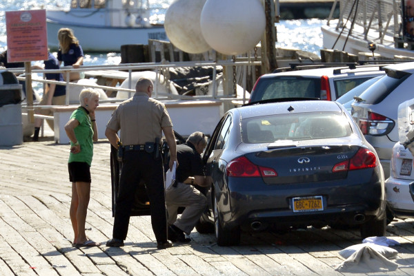 From left, vehicle operator Cheryl Torgerson, Knox County Sheriff's Sgt. John Palmer and Lt. Kirk Guerette look over the car that Torgerson was driving after she allegedly lost control, struck several cars and a family, killing a 9-year-old boy at the Monhegan Boat Landing in Port Clyde, in August of 2013. From left, vehicle operator Cheryl Torgerson, Knox County Sheriff's Sgt. John Palmer and Lt. Kirk Guerette look over the car that Torgerson was driving after she allegedly lost control, struck several cars and a family, killing a 9-year-old boy at the Monhegan Boat Landing in Port Clyde, in August of 2013.