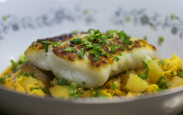 Roast cod in sweet pepper and crab broth with potatoes and hominy can be seen on Nov. 29 at Sammy's Deluxe in Rockland. The new restaurant focuses on Maine comfort food. Roast cod in sweet pepper and crab broth with potatoes and hominy can be seen on Nov. 29 at Sammy's Deluxe in Rockland. The new restaurant focuses on Maine comfort food.