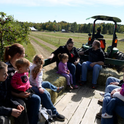 Visitors take a hayride at Treworgy Family Orchard in Levant in September 2016.