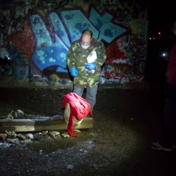 James Vaughn (center), of the Bangor Area Homeless Shelter, looks over discarded clothing with Scott Sergi (left), Bangor Area Homeless Shelter housing manager, and Sherrie House, Shaw House outreach councilor, under the I-395 bridge during the Department of Housing and Urban Development's annual Point-In-Time survey, done every January to provide a snapshot of what the homeless population looks like Wednesday in Bangor. 