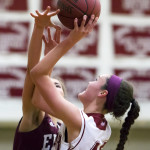 Bangor’s Katie Butler (right) puts up a shot against Edward Little’s Jordyn Reynolds during a game at Red Barry Gym in Bangor in December 2016. Bangor will open Class AA tourney play when it takes on Cheverus in a quarterfinal at 6 p.m. Wednesday at the Augusta Civic Center. 