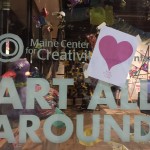 Paper hearts go up on Valentine's Day eve in Monument Square as Portlanders sleep. 