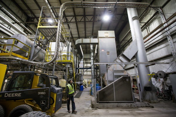 Robbins Lumber president Jim A. Robbins walks around the plant's existing biomass boiler, used to produce steam to heat the facility’s buildings and dry lumber in kilns. The company has plans for a new boiler with better pollution controls and the ability to produce power that can be sent to the grid. Robbins Lumber president Jim A. Robbins walks around the plant's existing biomass boiler, used to produce steam to heat the facility’s buildings and dry lumber in kilns. The company has plans for a new boiler with better pollution controls and the ability to produce power that can be sent to the grid.