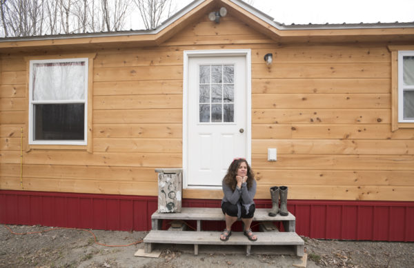 mary leaming sits in the front of her tiny home that is nearly complete leaming - Tiny House Financing mary leaming sits in the front of her tiny home that is nearly complete leaming - Tiny House Financing