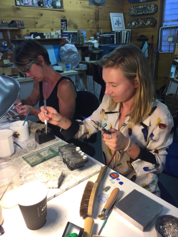 Jewelry makers Monica Davis, left, and Genny Mathews work with Lisa Hall in her workshop and store. "We're really good friends and we just have fun," Davis said. "We make beautiful things."
