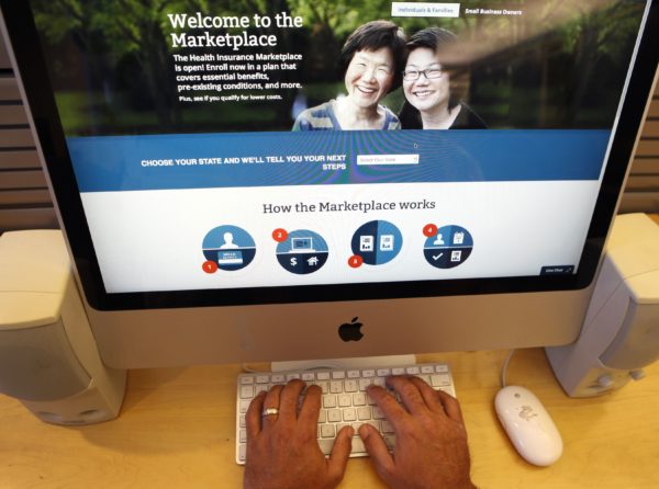 A man looks over the Affordable Care Act (commonly known as Obamacare) signup page on the HealthCare.gov website in New York, Oct. 2, 2013. 