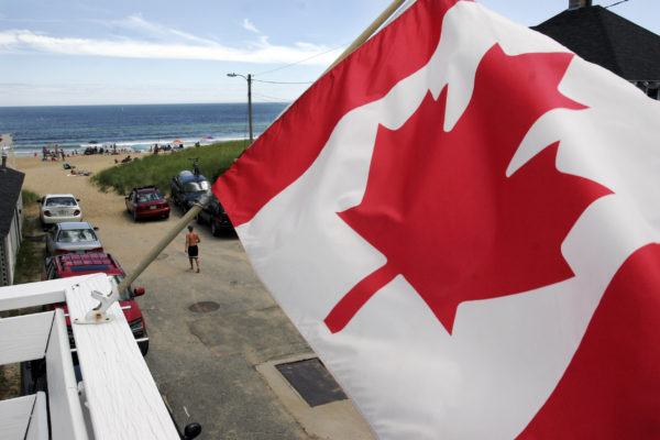 Pat Wellenbach | AP A Canadian flag flaps in the breeze along a street at Old Orchard Beach in this 2007 file