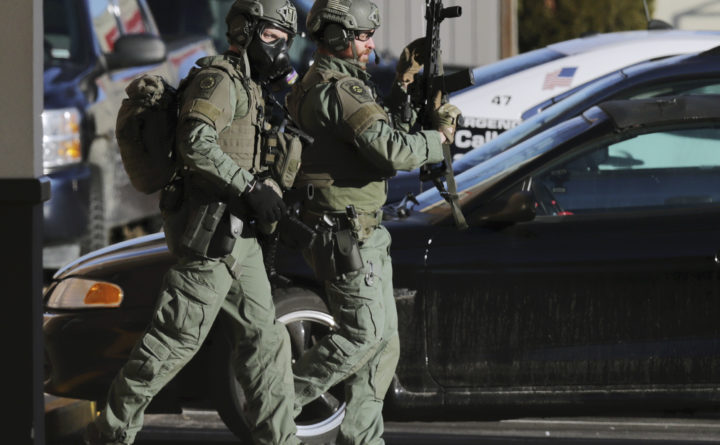 One dead, two barricaded inside New Hampshire hotel