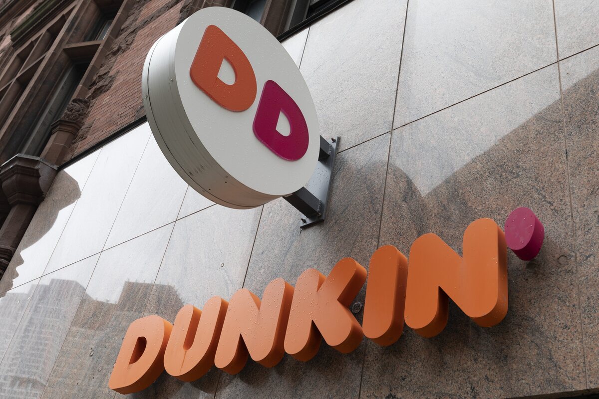 Car spins off road into Auburn Dunkin'