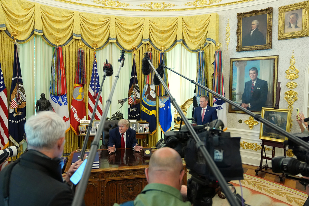 Live updates : AP - NORC poll shows who flies the American flag and why